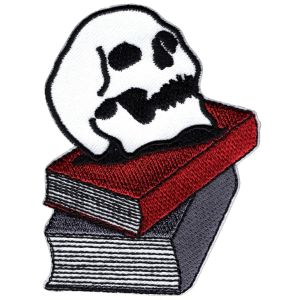 C And D Visionary Patch Skulls On Books